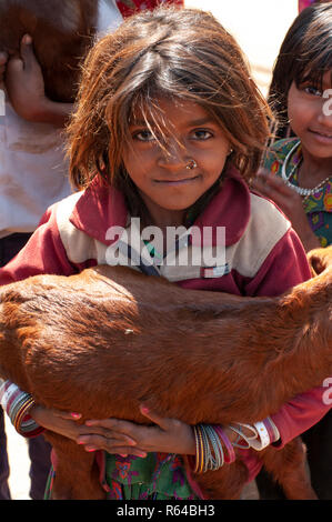 Rabari tribal girl with goat Stock Photo