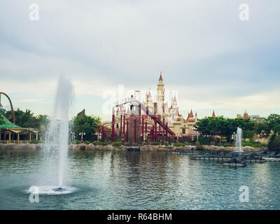 SINGAPORE - APRIL 11: Beautiful castle and roller coaster in Universal Studios on April 18, 2017. Universal Studios Singapore is theme park located within Resorts World Sentosa, Singapore. Stock Photo