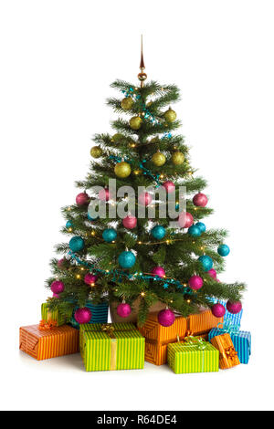 Wrapped gifts below illuminated christmas tree with green, pink, blue and purple baubles isolated on white background Stock Photo