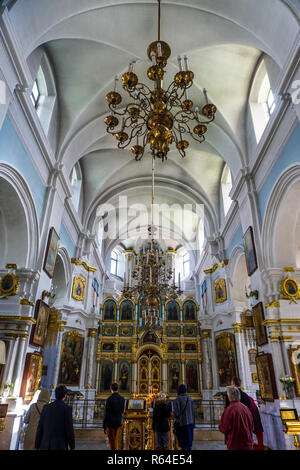 Minsk Holy Spirit Cathedral Interior View of Iconostasis and Chandelier with People Stock Photo