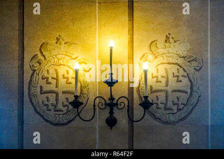 Nesvizh Castle Candle Holder with Three Candles on Wall and Jerusalem Crosses Stock Photo