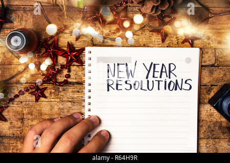 Person writing new year resolutions first person view Stock Photo