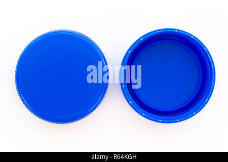 Blue plastic bottle caps. Studio shot. Plastic waste. Isolated on a white background. Stock Photo