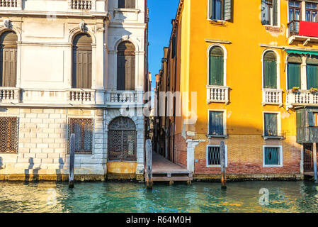 Narrow Venice street between two palaces on the bank of the Gran Stock Photo