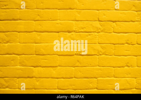 Close up of modern yellow brick tiles wall texture background. Stock Photo