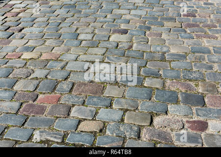 Colored Cobblestone pavement in summer Stock Photo