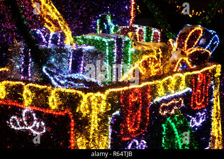 Abstract composition from many holiday colored lights outdoor on backdrop at night Stock Photo