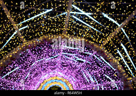 Abstract composition from many colored defocused round lights outdoor at night Stock Photo