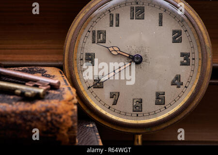 Panta rhei concept: Antique pocket watch, vintage keys and pile of old books on natural cork background. Stock Photo