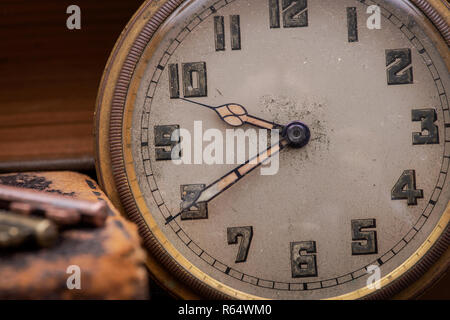 Panta rhei concept: Antique pocket watch, vintage keys and pile of old books on natural cork background. Stock Photo