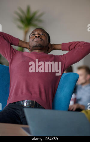 Close-up Of Person Typing On Laptop At startup office. Stock Photo