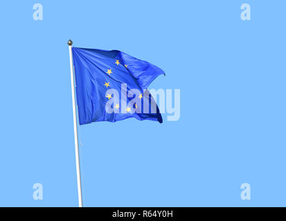 European Union EU flag flies over clear blue sky Stock Photo