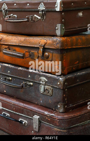 Stack of old vintage travel suitcases close up Stock Photo