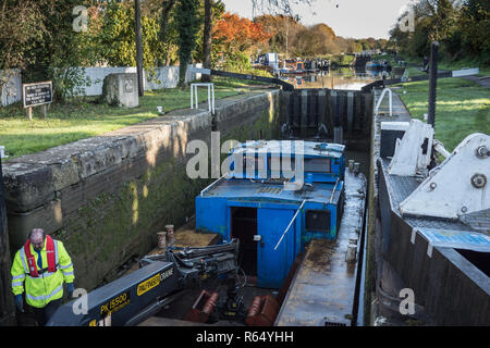 Canal and Rivers Trust work boat at  Sir Hugh Stockwell lock on Caen Hill Flight, Wiltshire, UK. Stock Photo