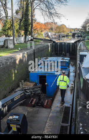 Canal and Rivers Trust work boat at  Sir Hugh Stockwell lock on Caen Hill Flight, Wiltshire, UK. Stock Photo