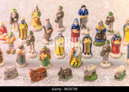 Small figurines of santons from French Provence used like beans of the cake of the kings during the Epiphany also called the Little Christmas on a gli Stock Photo