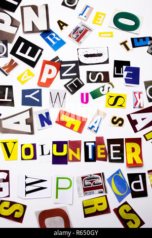 A word writing text showing concept of Volunteer made of different magazine newspaper letter for Business case on the white background with copy space Stock Photo