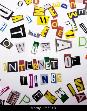 A word writing text showing concept of Internet Of Things made of different magazine newspaper letter for Business case on the white background with copy space Stock Photo