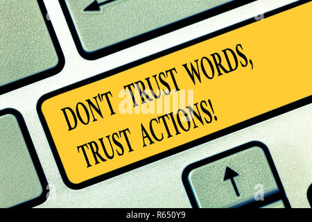 Conceptual hand writing showing Don T Trust Words Trust Actions. Business photo text Less talking more things done action taken Keyboard key Intention Stock Photo