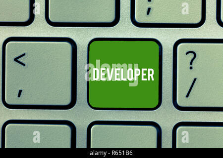 Conceptual hand writing showing Developer. Business photo showcasing demonstrating or thing that develops grows or matures something Keyboard Intentio Stock Photo