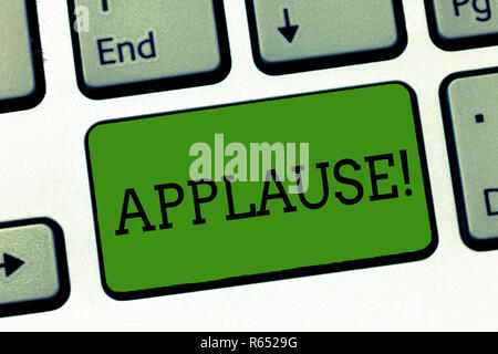 Conceptual hand writing showing Applause. Business photo showcasing approval or praise expressed by clapping cheering whistling Keyboard Intention to  Stock Photo