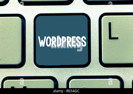 Conceptual hand writing showing Wordpress. Business photo showcasing free source publishing software that can installed web server Keyboard Intention  Stock Photo