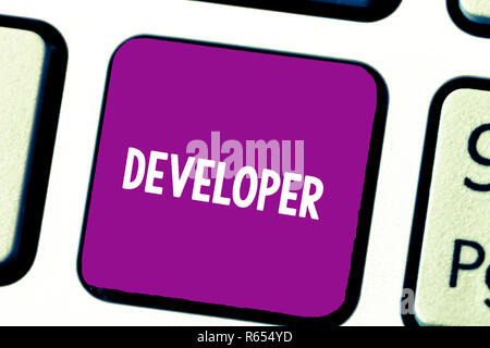 Text sign showing Developer. Conceptual photo demonstrating or thing that develops grows or matures something Keyboard key Intention to create compute Stock Photo