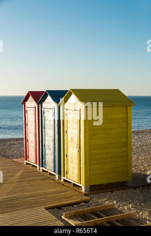 Several multicolored huts on a Mediterranean resort beach Stock Photo