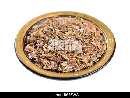 Stack of Dill seeds isolated on white background. Stock Photo
