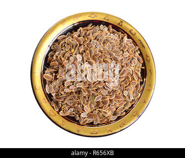 Stack of Dill seeds isolated on white background. Stock Photo