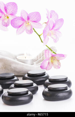 Spa concept with hot stones and candle Stock Photo