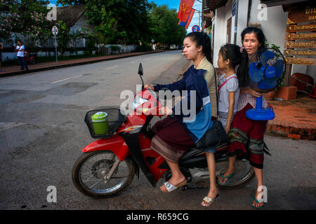 Motorbike on main street Sisavangvong Road in Luang Prabang, Laos Stock Photo