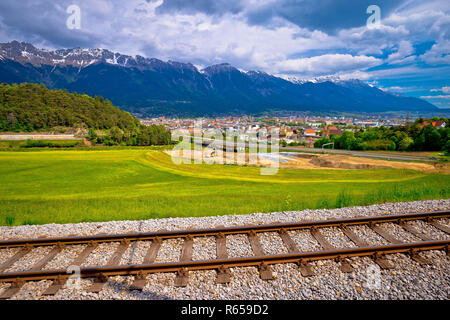 Panoramic aerial view of Innsbruck and Hafelekarspitze mountain with railroad tracks Stock Photo