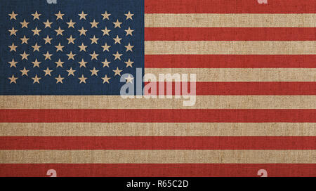 Old vintage faded American US flag over canvas Stock Photo