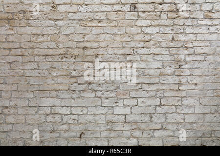 Wall of white travertine adarce stone bricks Stock Photo