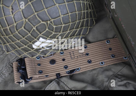 ww2 us army pistol belt and helmet with ace of spades emblem on green ...