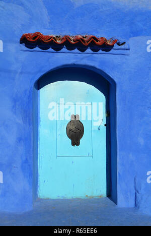 Traditional powder blue painted house facade in the historical Medina of Chefchaouen, Morocco. Stock Photo