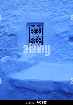 Traditional powder blue painted house facade in the historical Medina of Chefchaouen, Morocco. Stock Photo