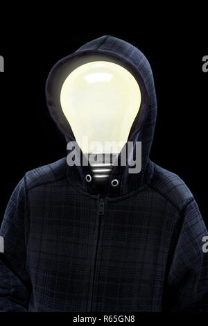 Mysterious man wearing hoodie in silhouette with a light bulb on his head isolated on black background. Concept of mystery, creativity, bright ideas,  Stock Photo