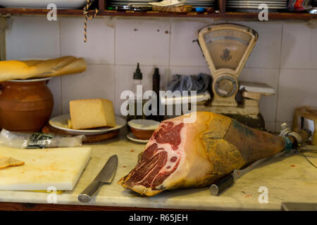 Jamon Serrano or Iberico (dry cured ham) in Spanish tapas bar in Seville, Andalucia, Spain. Stock Photo