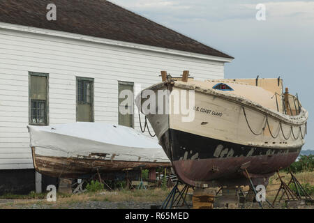 Old US Coast Guard Boat next to Life Saving Museum, Hull, MASS. In the past century fishermen relied on help when their boats ran aground, or crashed. Stock Photo