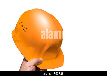 Construction helmet, head protection in hand men Stock Photo