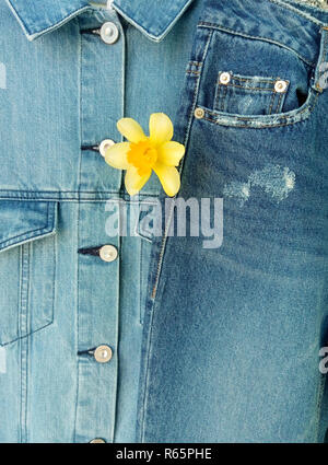 double denim jacket and jeans, spring fashion trend, flower in clothes Stock Photo