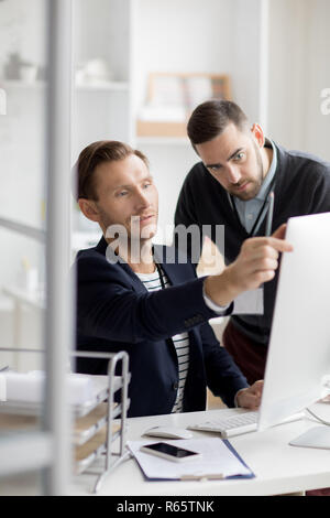Office Workers Using Computer Stock Photo