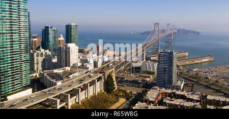 Traffic goes in and out of town via upper and lower decks on the Bay Bridge in San Francisco CA Stock Photo
