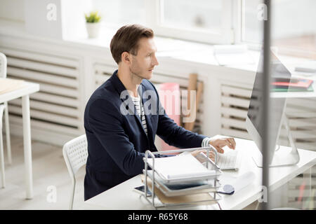 Handsome Man at Workplace Stock Photo