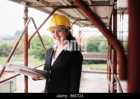 Happy Woman Working As Architect In Construction Site Stock Photo
