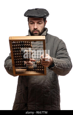 Old fashioned bearded man counts on retro wooden abacus, studio shot. Isolated on white background, with clipping path Stock Photo