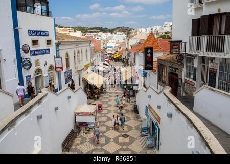 ALBUFEIRA, PORTUGAL - JULY 13TH 2018: A view looking down the pedestrianised Rua 5 de Outubro in the old town area of Albufeira in Portugal, on 13th J Stock Photo