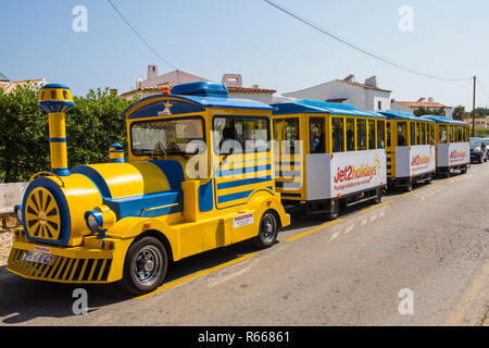 ALBUFEIRA, PORTUGAL - JULY 13TH 2018: A view of the little tourist train in the city of Albufeira, Portugal on 13th July 2018. Stock Photo